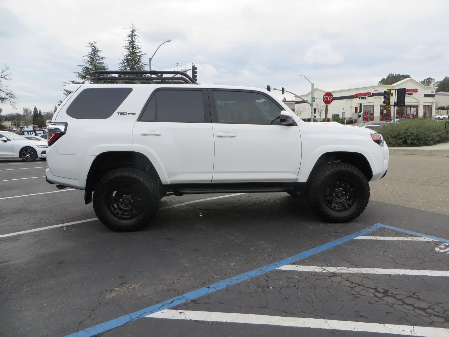 2019 White /BLACK Toyota 4Runner TRD Pro (JTEBU5JR3K5) with an 4.0L V6 engine, 5 -Speed Automatic transmission, located at 2630 Grass Valley Highway, Auburn, CA, 95603, (530) 508-5100, 38.937893, -121.095482 - Features Ironman 4X4 suspension, BFG tires, Rockslider, Roof rack, window tint, and interior Rago Fab Molle storage racks. - Photo#3